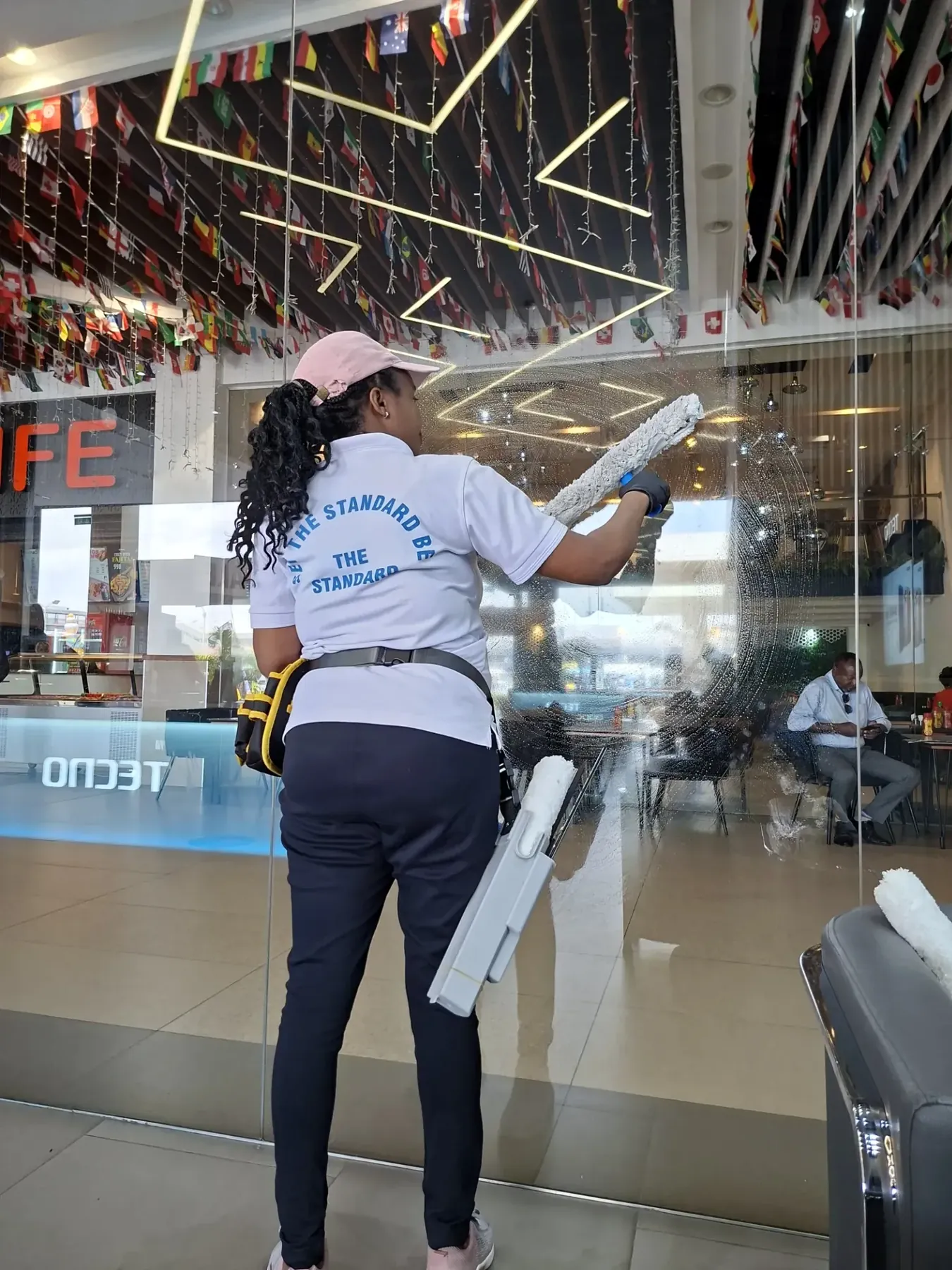 NUVORA cleaner professionally washing large commercial glass