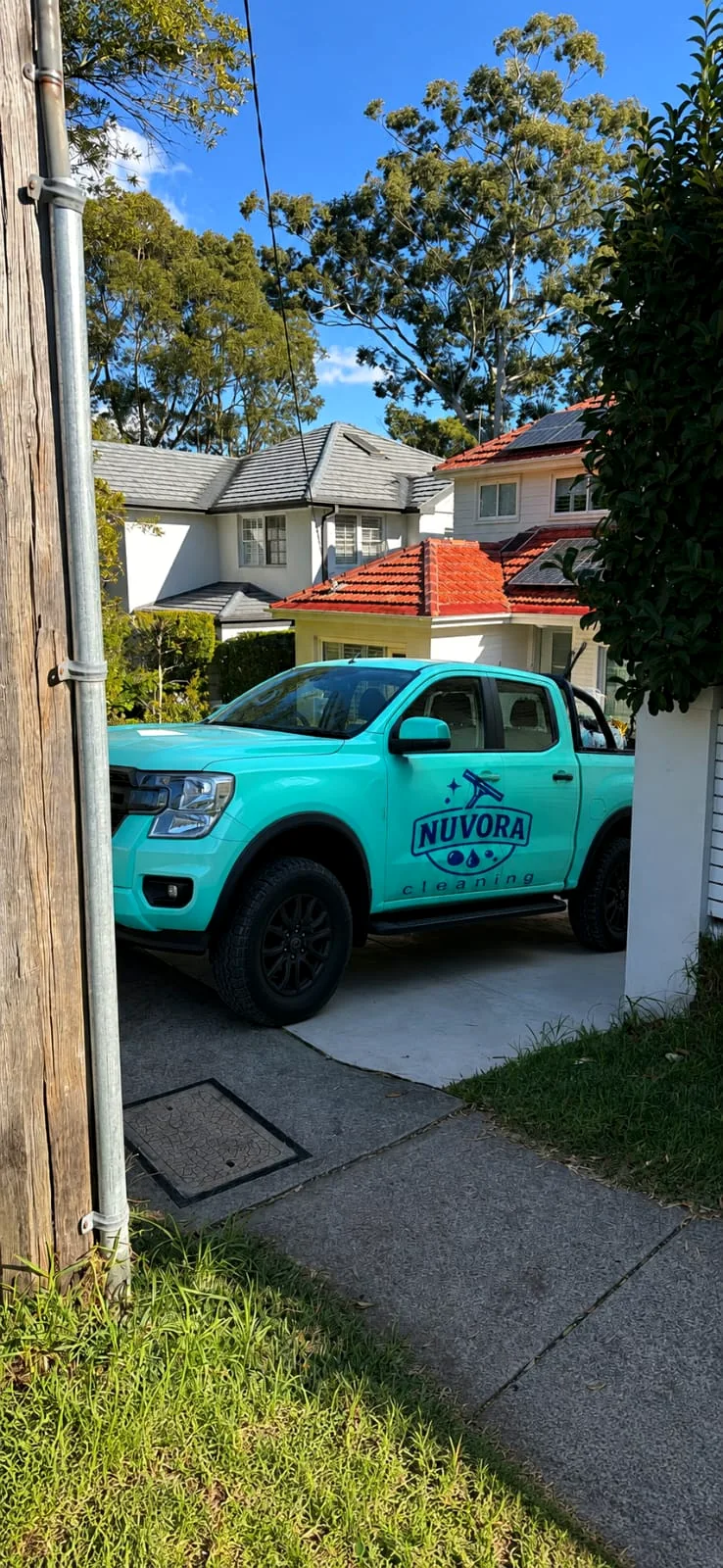 NUVORA Cleaning Services vehicle at a client property